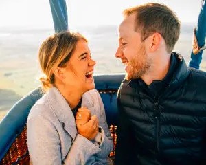 A couple enjoying a hot air balloon ride