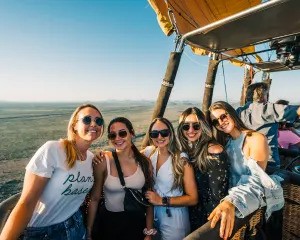 Group of Girls enjoying hot air balloon ride in USA